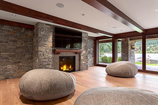 Not only can a custom stone fireplace add warmth and texture to your space, it can also add significant value to your home.